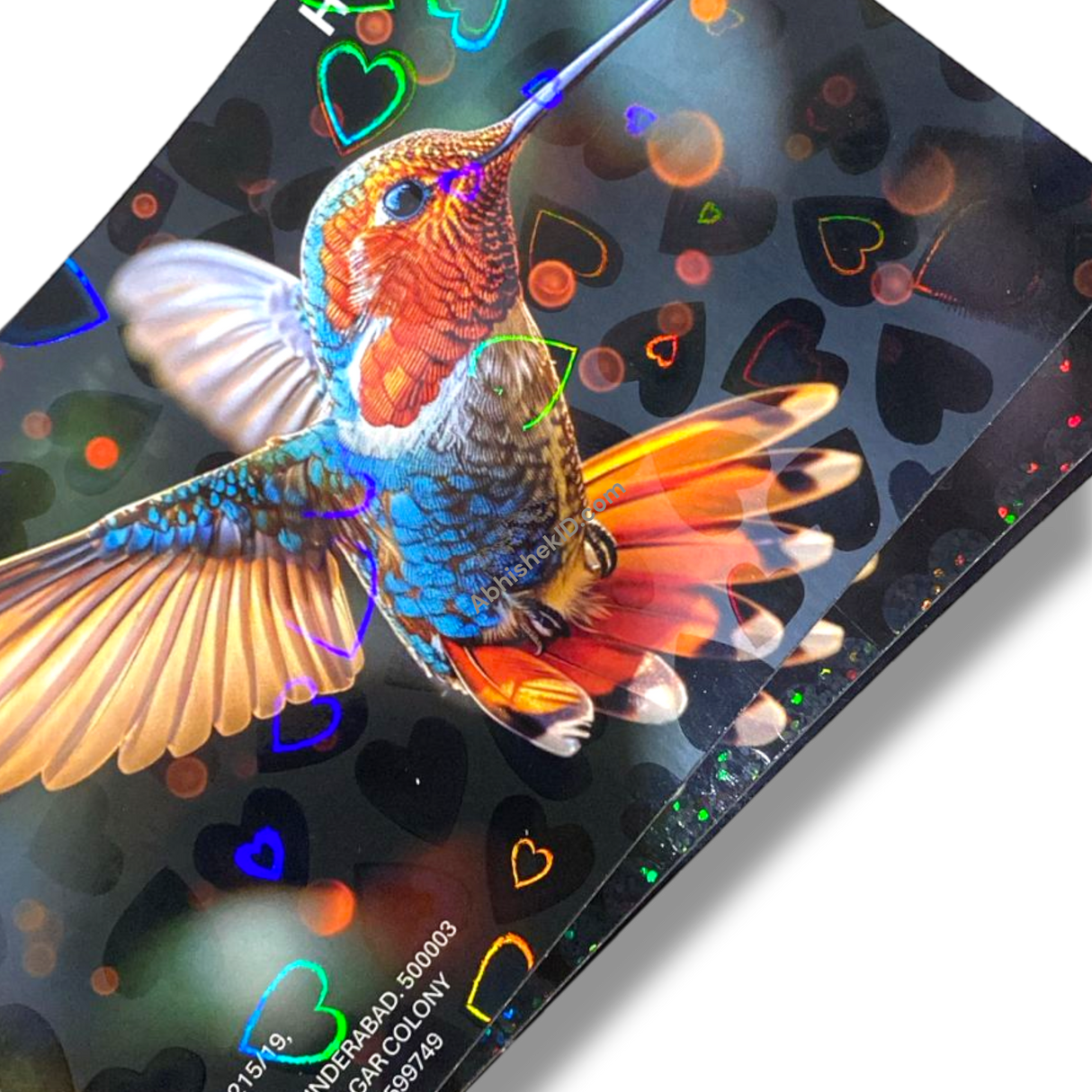 Holographic Heart Thermal Lamination Roll 330MM x 100 Meter x 27 Micron, clear film with heart pattern over hummingbird print