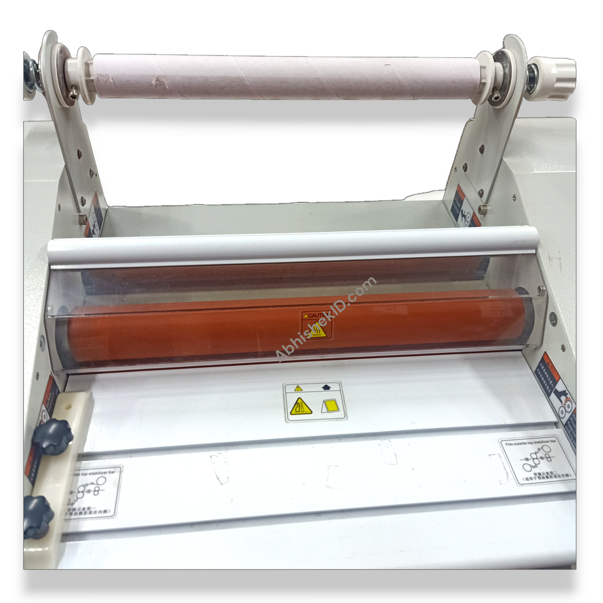Functional demonstration of 13 Inch Roll Thermal Lamination Machine applying glossy film to business materials.