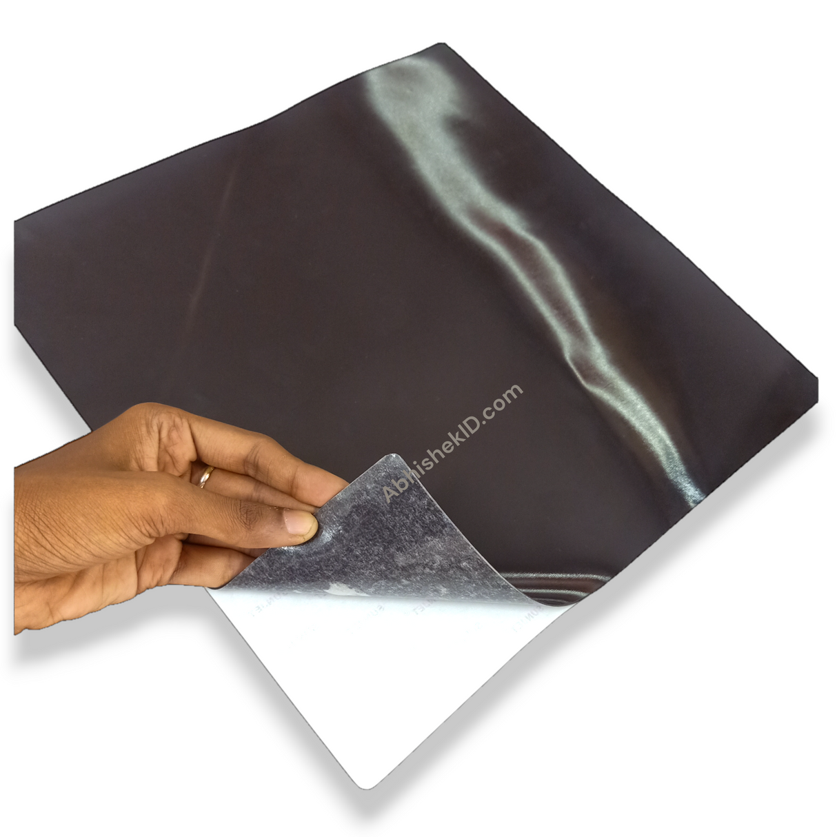 Stacked layout of 1mm Adhesive Flexible Magnetic Sheet for bulk commercial display fabrication.