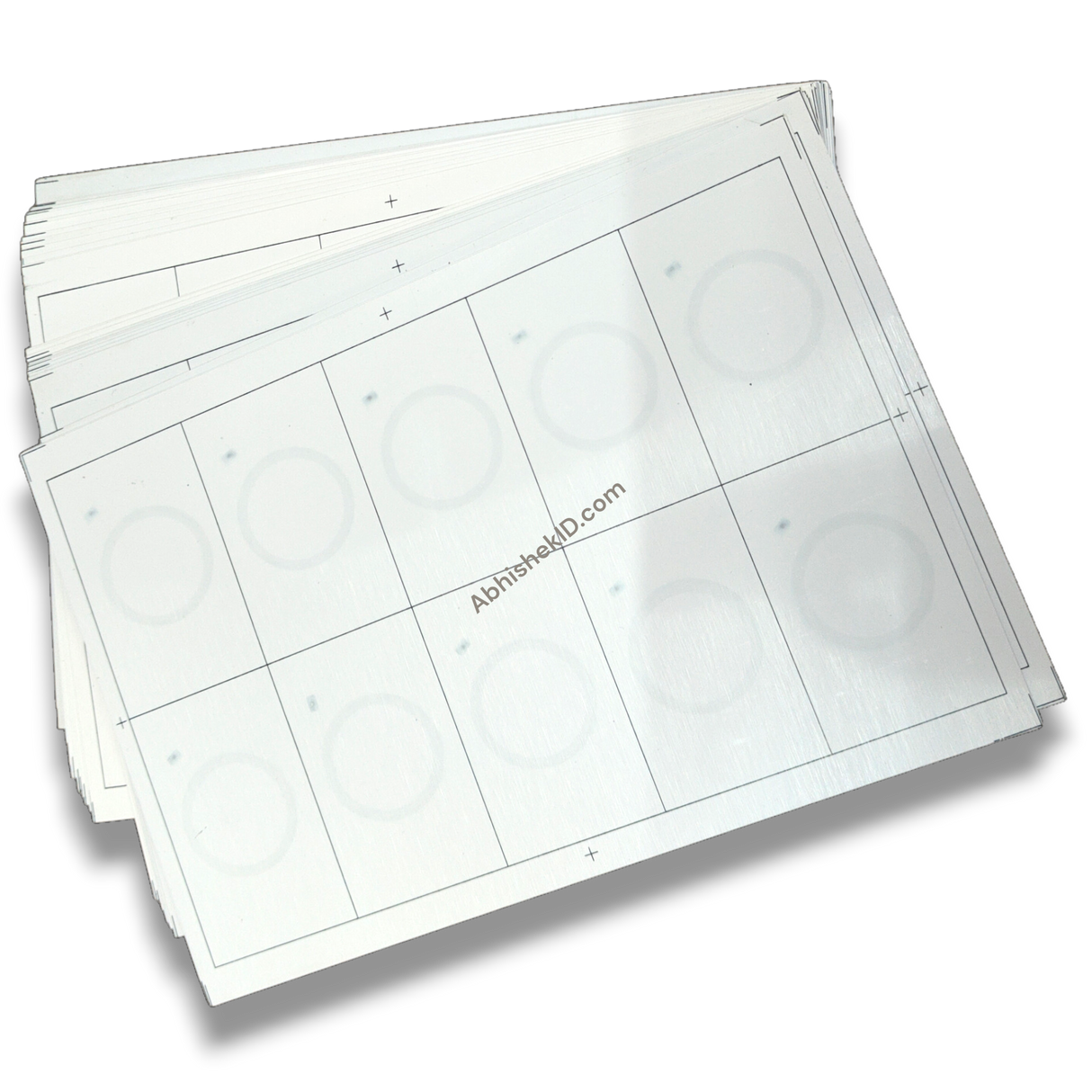 Close-up of embedded 125 kHz round RFID chips in A4 PVC prelam inlay sheet