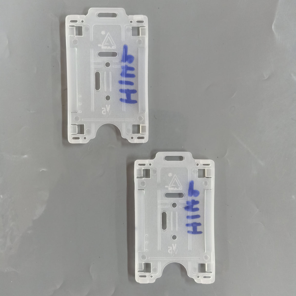 H142 Semi-Transparent Dual PVC Vertical ID Card Holder safeguarding employee transit passes in busy commercial centers.
