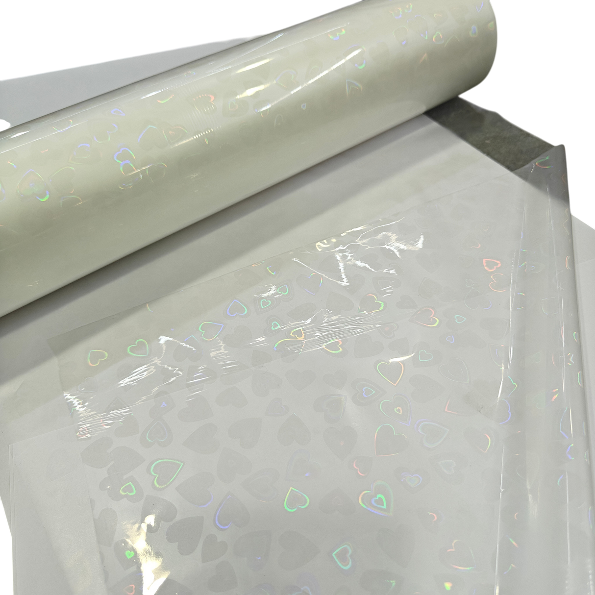 Holographic Heart Thermal Lamination Roll, 330MM x 100 Meter x 27 Micron, clear film with iridescent heart pattern
