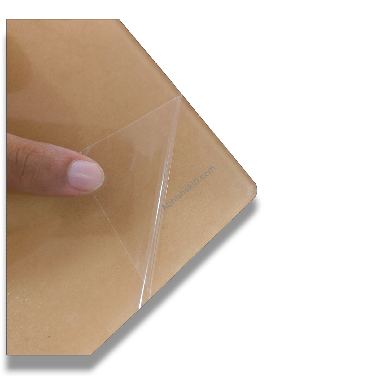 Peeling scratch-proof acrylic release paper before pasting laminated photo print