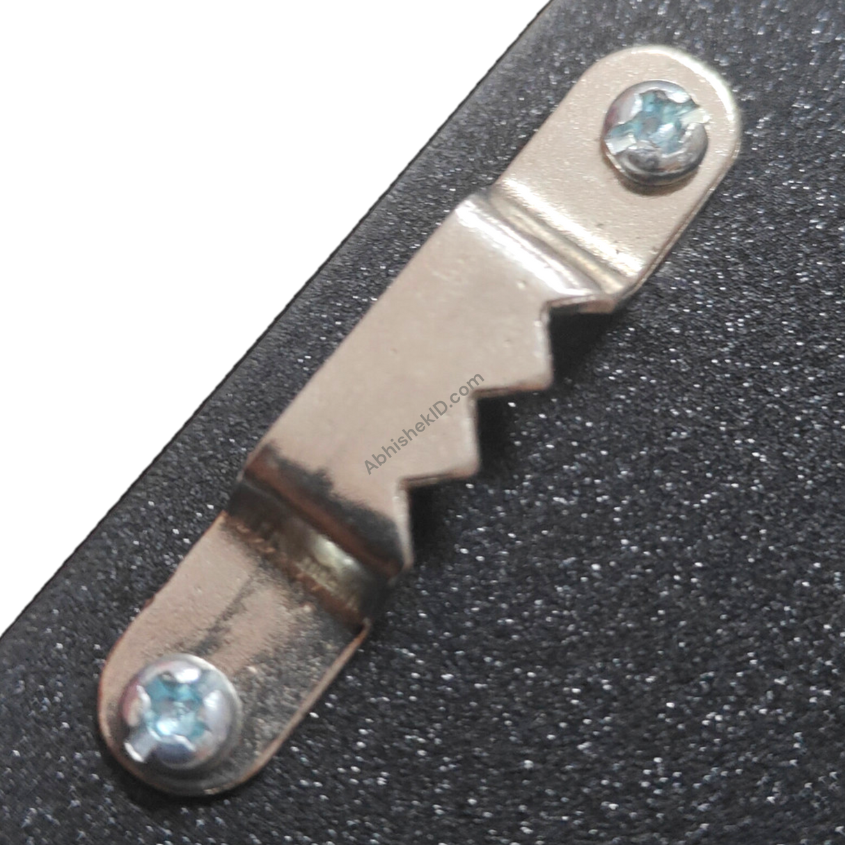 A4 LED Light Frame wall hanging hardware, silver metal sawtooth hanger with screws on black MDF.