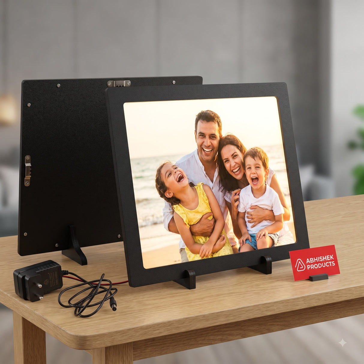 A4 LED Light Frame – Premium black MDF, tabletop display with family portrait, wall hanging option visible.