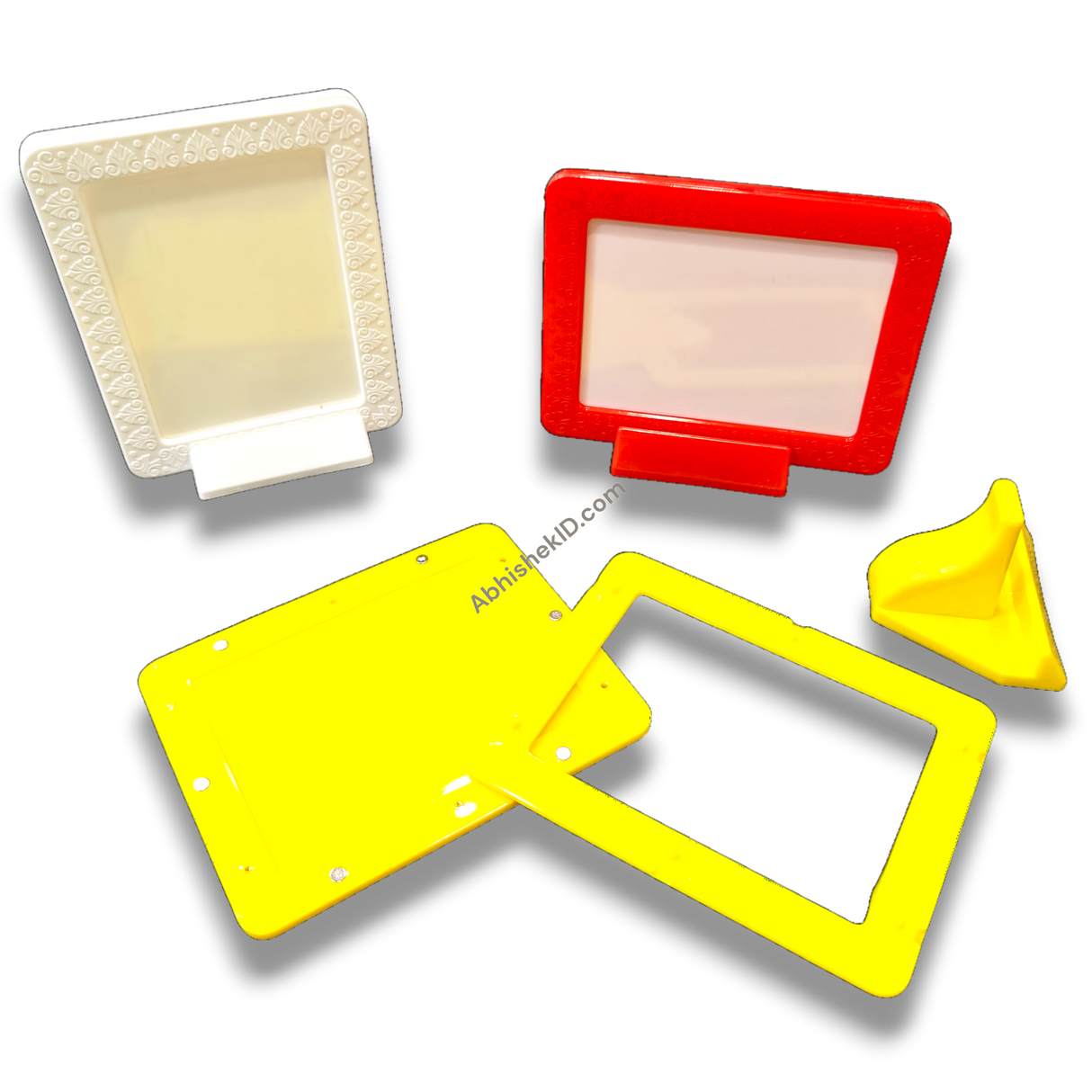 Colorful magnetic tabletop frames 3x4 inch. White, red, yellow frames displaying family portraits. Home decor.