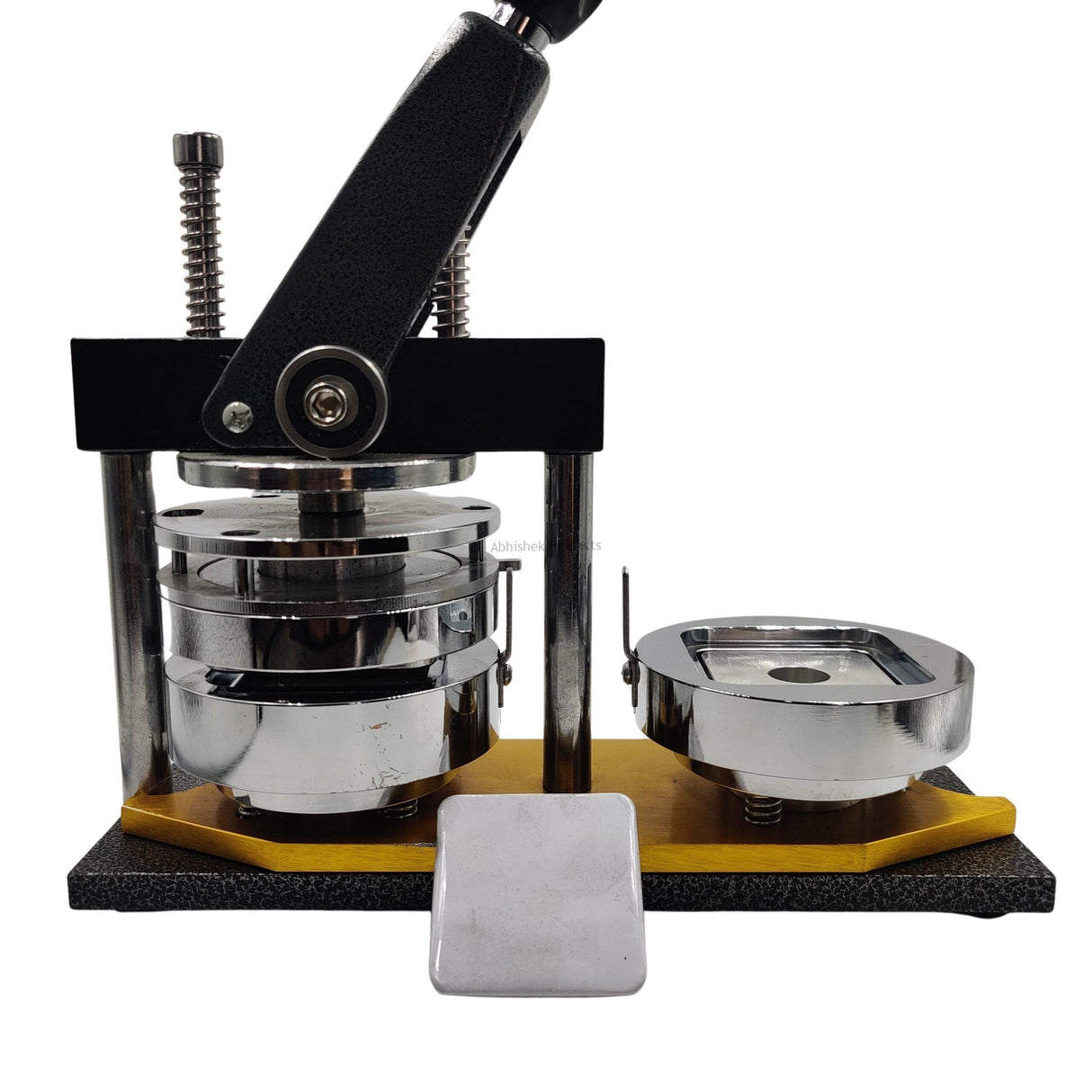 Square Button Badge Machine 50x50mm utilized in commercial print shops for promotional merchandise fabrication.