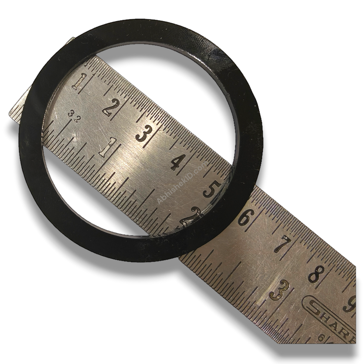 Black plastic Button Badge Ring, 58mm or 44mm die height washer spacer, shown with ruler for size.
