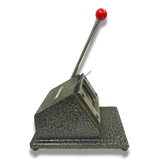 61mm Imported Square Die Cutter, heavy-duty metal in speckled gray with a red handle, for fridge magnets & badges.