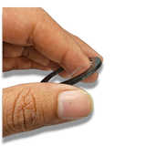 Hand holding a black Button Badge Ring 58mm/44mm die height washer spacer for badge press dies.