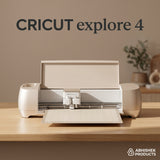 Beige Cricut Explore 4 Smart Cutting Machine with loaded cutting mat on a wooden table for precision DIY crafting.