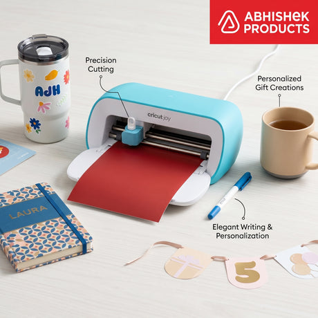 Teal Cricut Joy 2 precision cutting red vinyl for personalized crafts, custom mugs, and elegant journal designs.