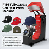 F136 Fully Automatic Cap Heat Press Machine, red and black metal, pressing a navy cap, with various caps displayed.