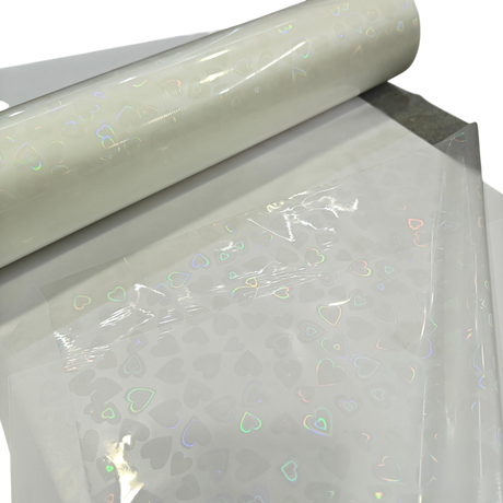 Holographic Heart Thermal Lamination Roll, 330MM x 100 Meter x 27 Micron, clear film with iridescent heart pattern