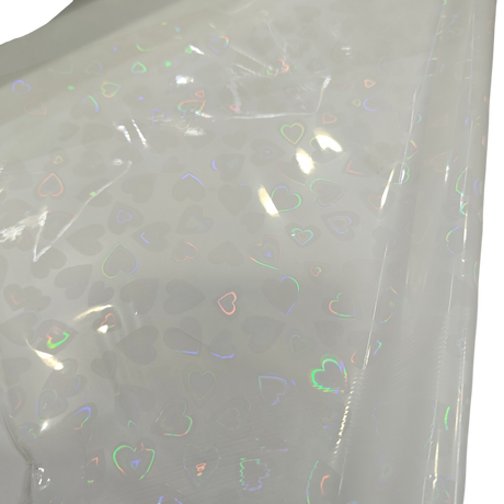 Holographic Heart Thermal Lamination Roll, clear film with iridescent heart patterns, 330MM x 100 Meter x 27 Micron.