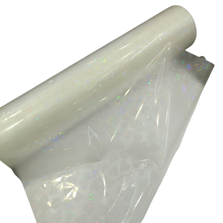 Holographic Heart Thermal Lamination Roll, 330MM x 100 Meter x 27 Micron, clear plastic with iridescent heart pattern