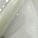 Holographic Heart Thermal Lamination Roll, clear film with iridescent heart pattern, 330MM x 100M x 27 Micron.