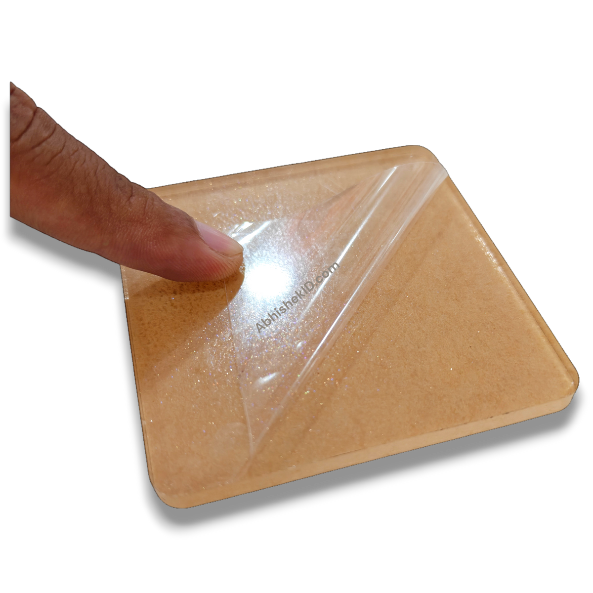 74mm square clear acrylic paperweight DIY blank for desk, inserts, and gifts, with protective film being peeled.