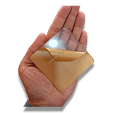 74mm square clear acrylic paperweight DIY blank for inserts, held in hand, with protective film peeling.