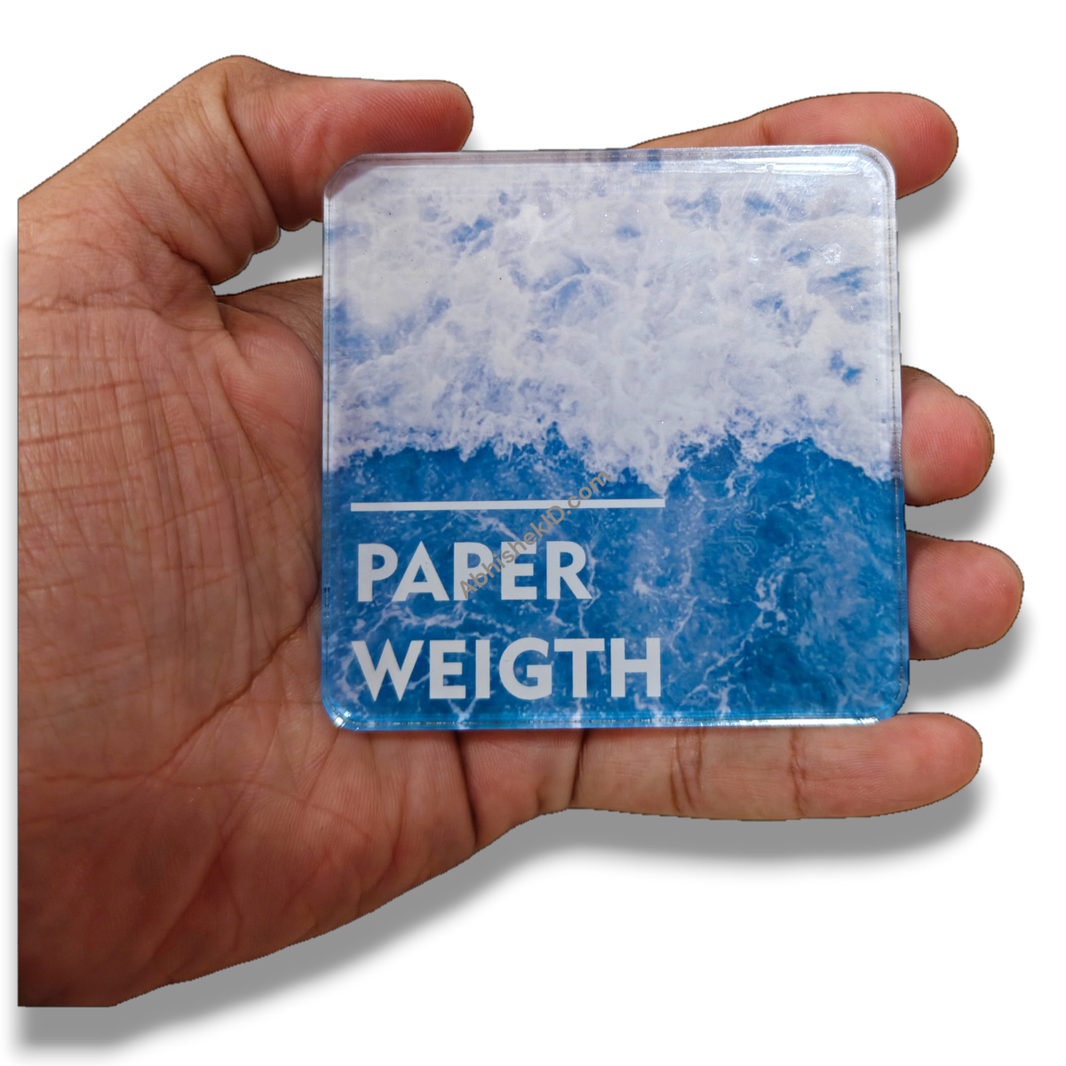 74mm square clear acrylic paperweight DIY blank for custom inserts, held in hand, for desk or gifts.