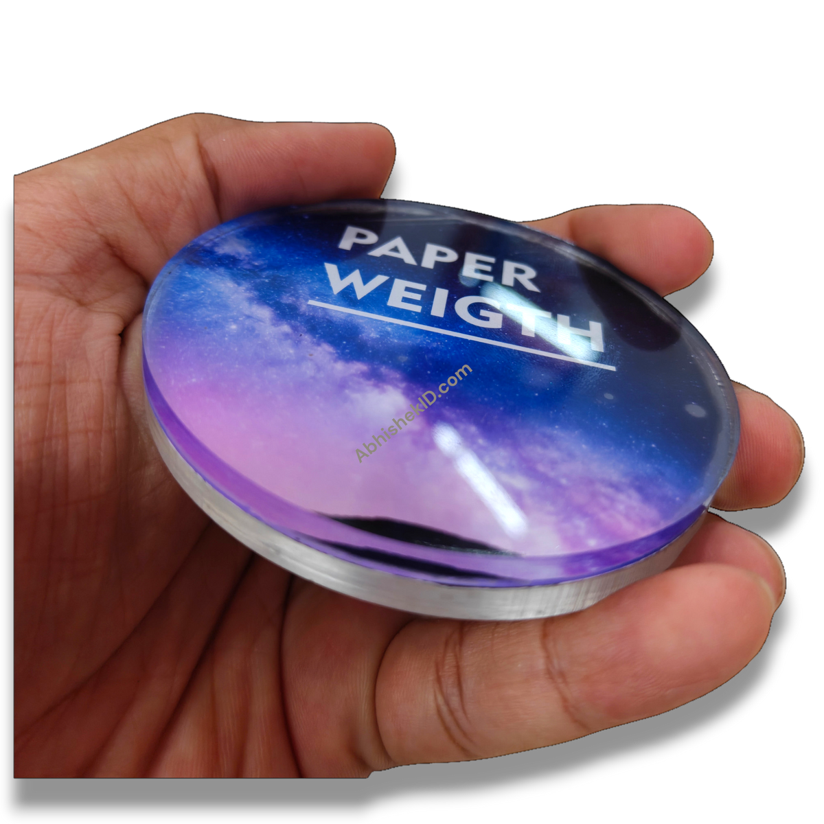 74mm Round Acrylic Paper Weight DIY Set, clear 5mm sparkle gumming, held in hand, blue and purple galaxy design.