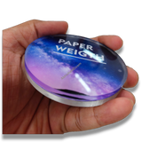 74mm Round Acrylic Paper Weight DIY Set, clear 5mm sparkle gumming, held in hand, blue and purple galaxy design.