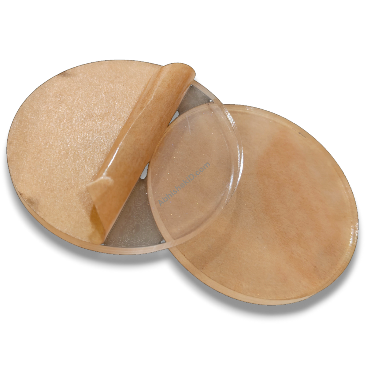 74mm Round Acrylic Paper Weight DIY Set, clear 5mm sparkle gumming, with protective backing partly peeled.