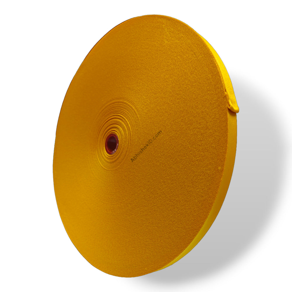 Top-down angle of yellow 12mm Colour Satin Roll used for employee ID badge fabrication.